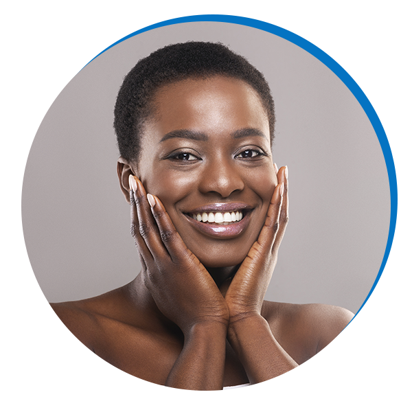 photo of woman with great skin holding her face