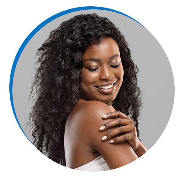 woman clutching her shoulder admiring her beautiful skin
