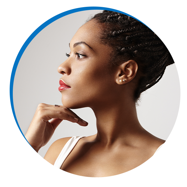 woman with clear skin resting her chin on her hand