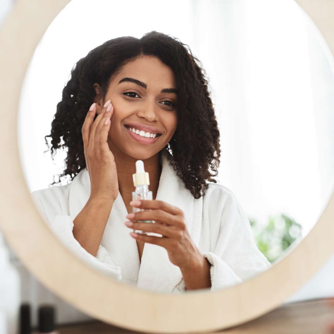 woman applying skin care product