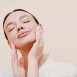 A woman doing face yoga