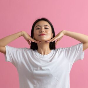 A woman happy with her face yoga routine